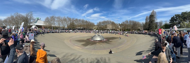 Photo:  11 am approximately on 2025-04-05 showing crowd surrounding  Seattle Center fountain.